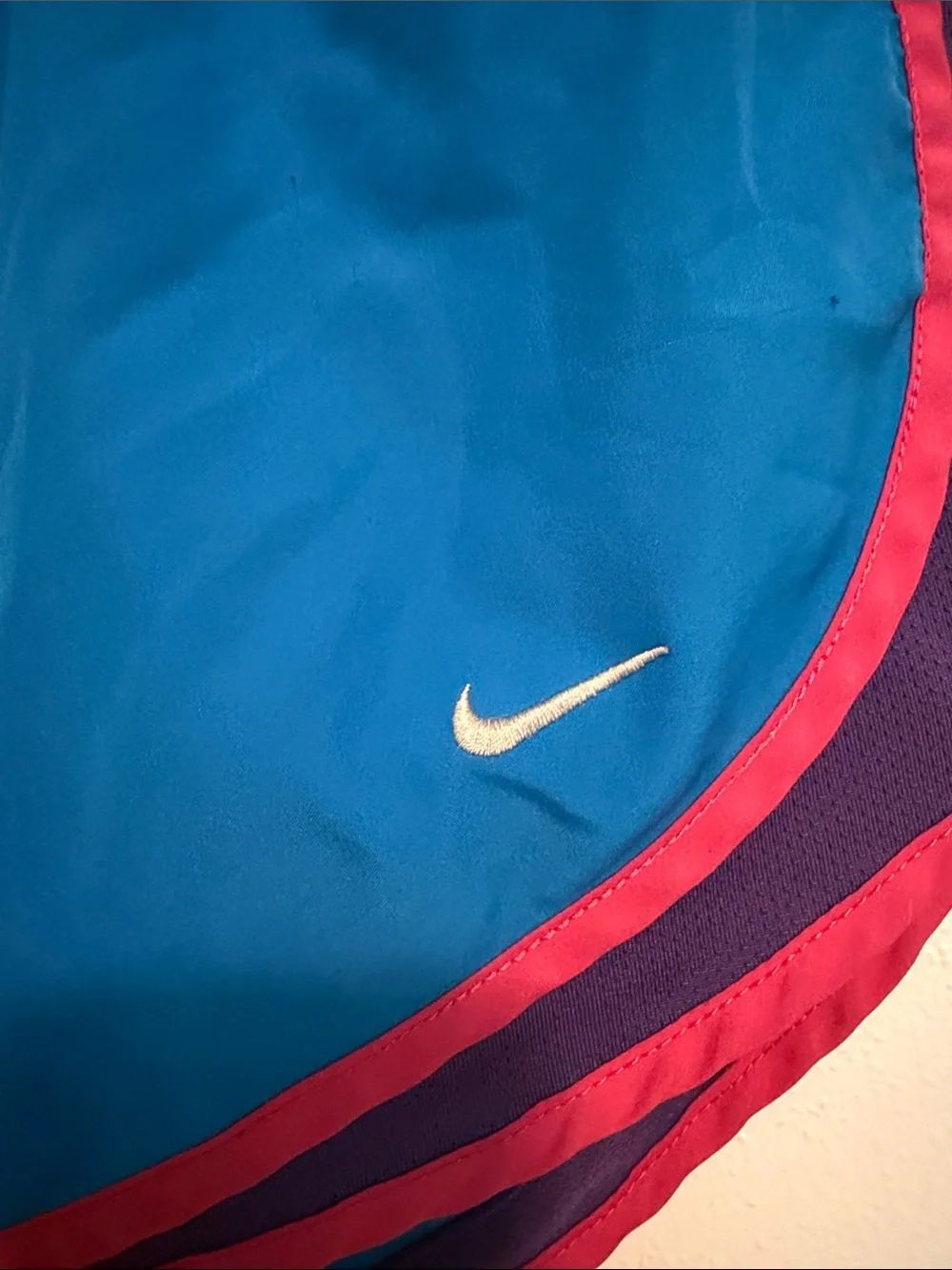 Nike Women's Bright Blue Athletic Shorts with Pink and Purple Accents